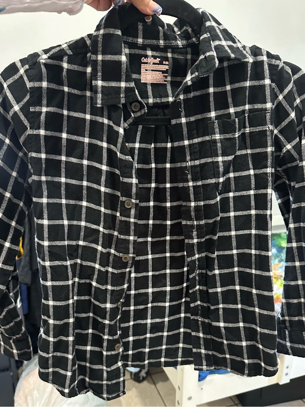 Plaid button up shirt.
